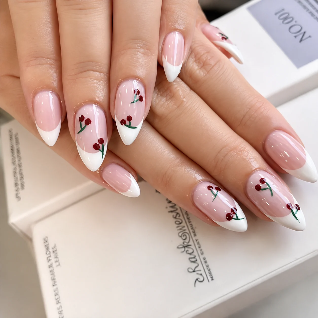 Cherry design on French almond tips
